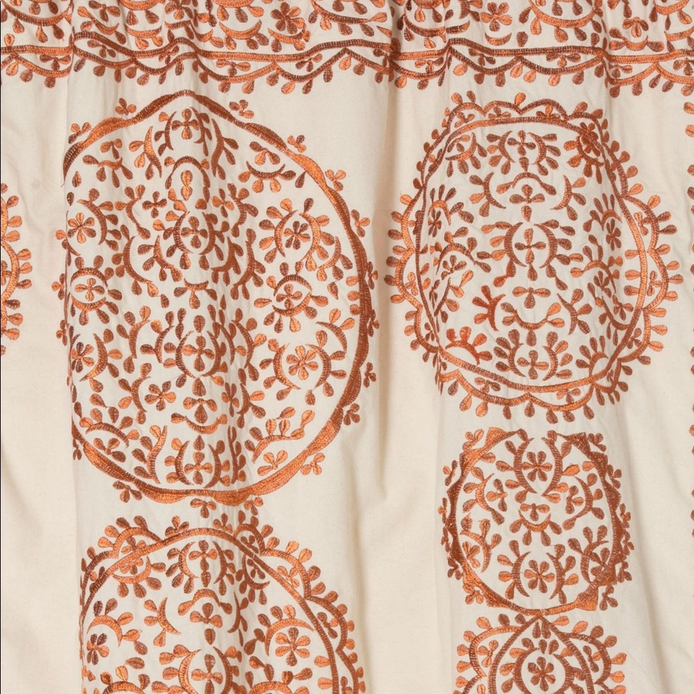 embroidered medallion curtains in metallic rust